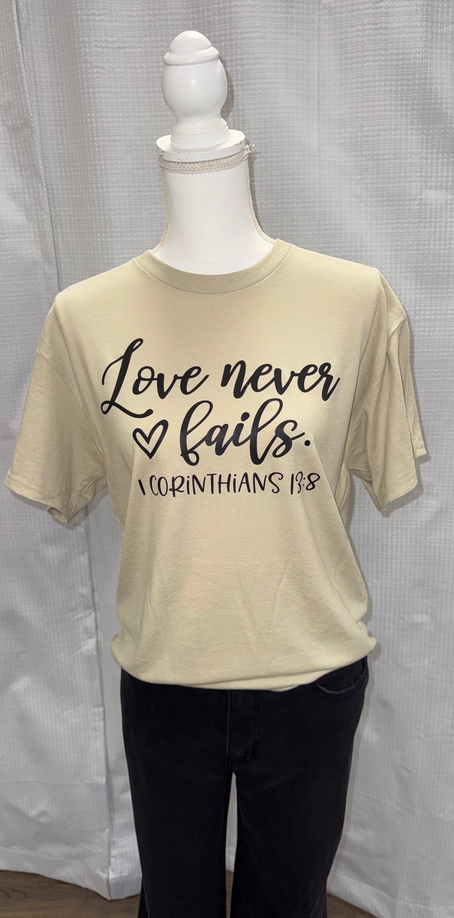 Love never fails tee