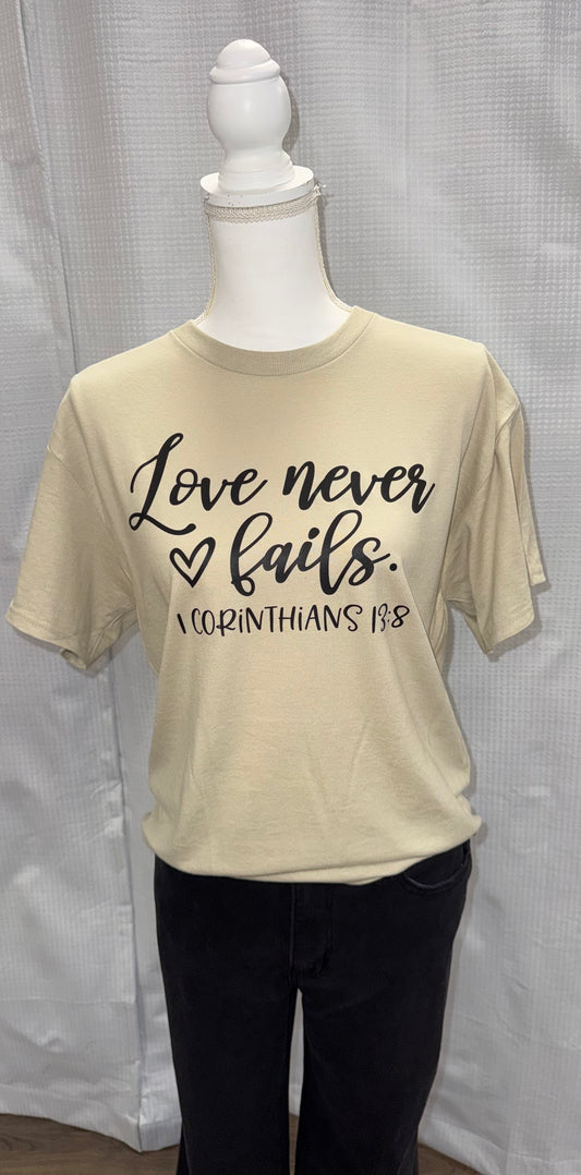 Love never fails tee
