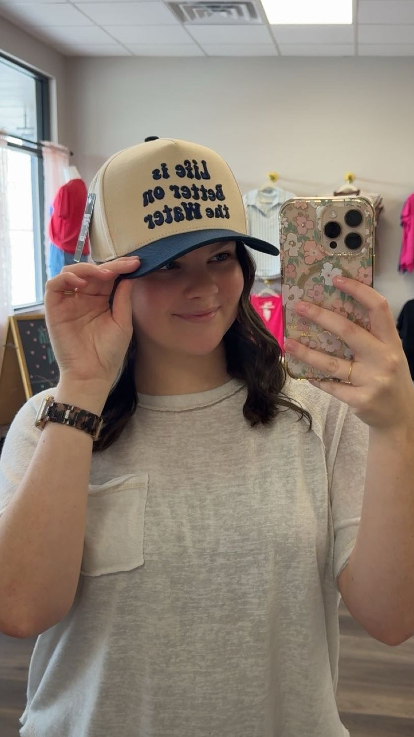 Life is better on the water trucker hat