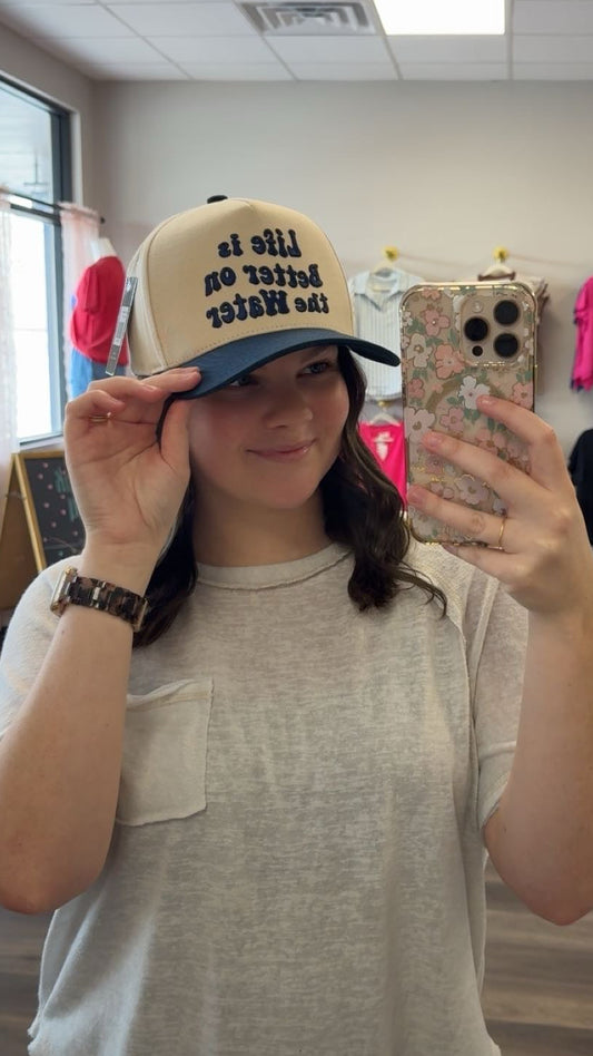 Life is better on the water trucker hat